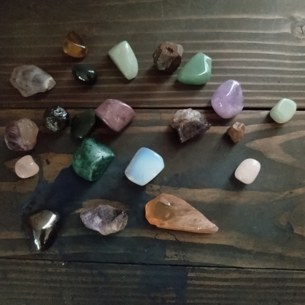 These lovely precious raw and polished gemstones, amethyst, garnets, and more